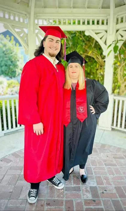 Amber Williams and son in graduation garb
