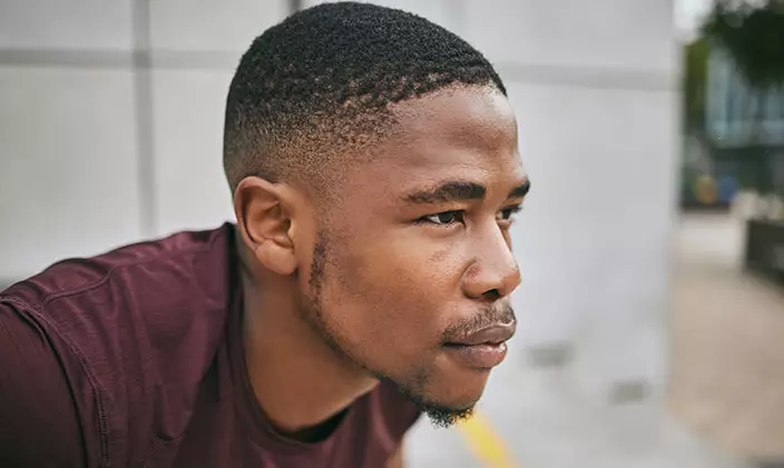 Driven African American man with determined look on his face