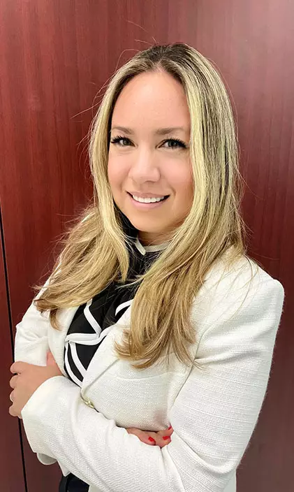 Image of Giselle Poveda in a white blazer