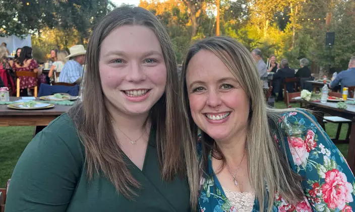 Kelly and Jenny Guire, UOPX alumni, nurses and daughter and mother photographed outside