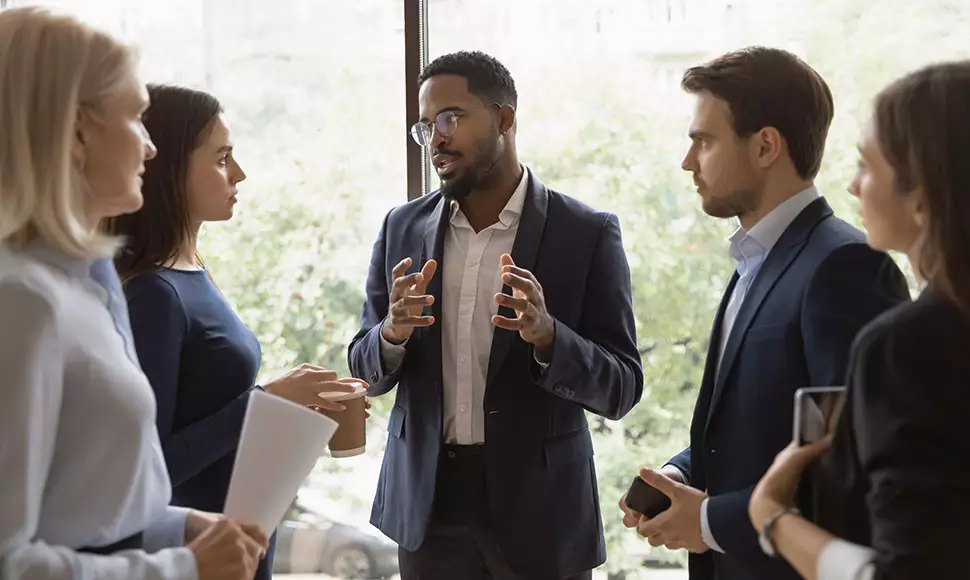 African American man speaking to group