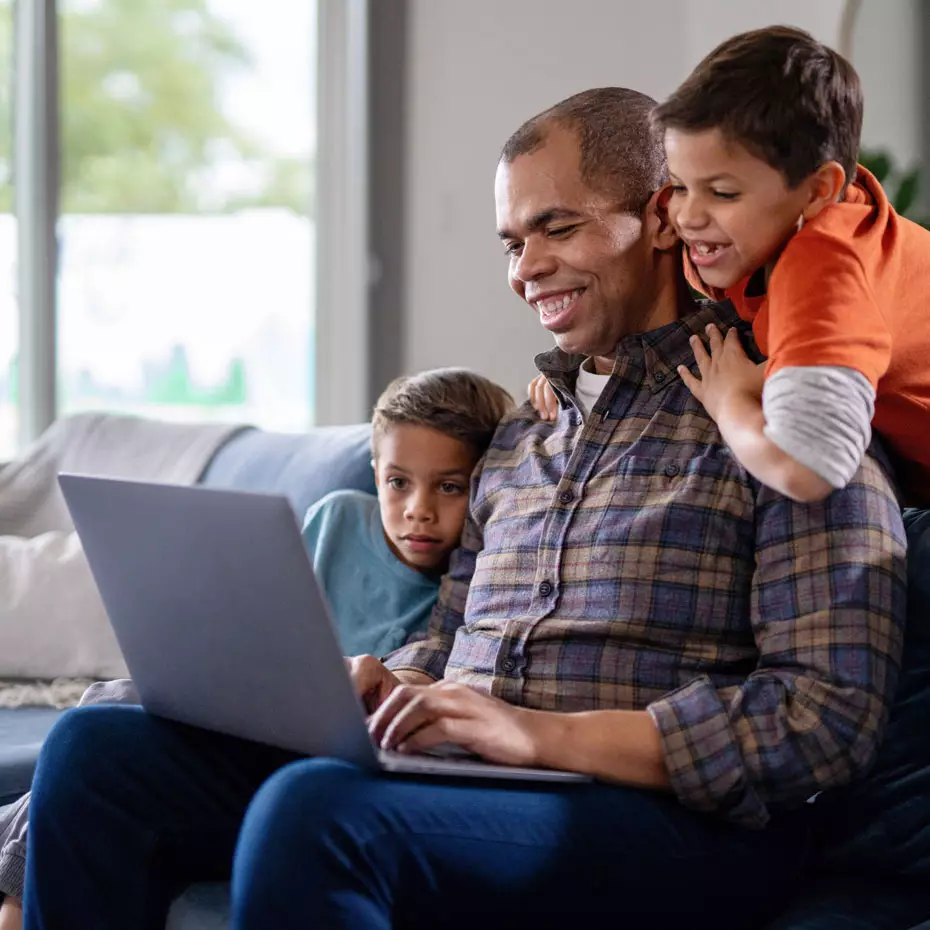 Stephen P. happily shares an encouraging message from his Academic Advisor with his 2 young sons