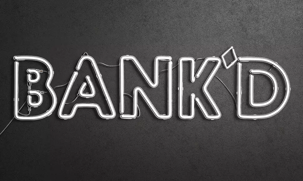 Flashing Animation of a glowing sign that says "Bank'd - The cost of college". 