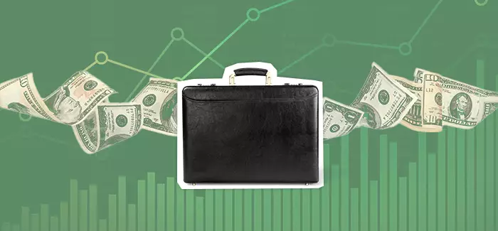 An image of a suitcase with ten dollar bills floating behind it to signify what is a CFO