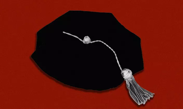 Black and white doctoral graduation cap on red background