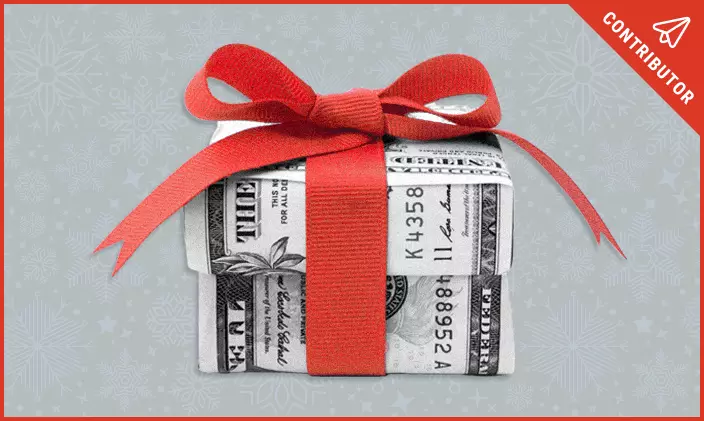 A holiday gift wrapped in money and a red bow