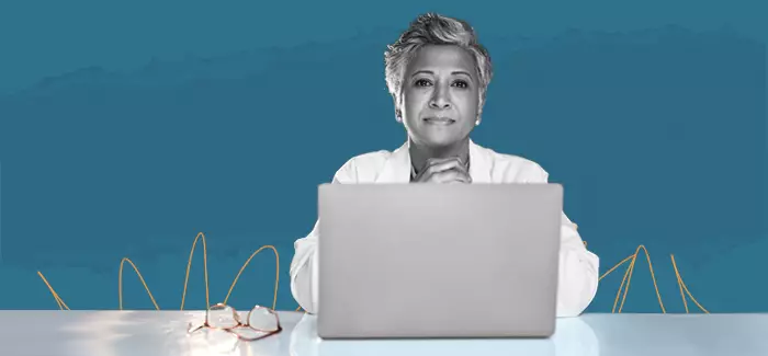 A DNP-prepared nurse presents research findings about surgical site infection prevention in a university lecture hall.