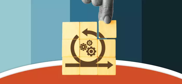 Fingers stacking blocks with product cycle icons to represent product life cycle