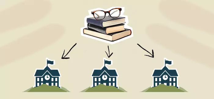 Three school houses and a stack of books and glasses on top to signify school superintendent