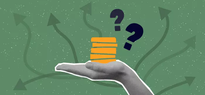 Coins in a palm to signify financing college