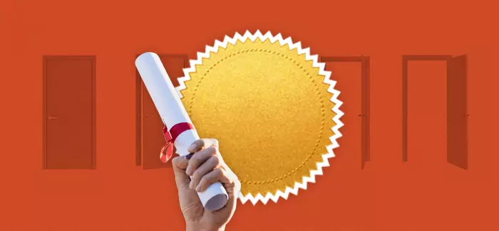 Image of a hand holding a diploma over a gold certificate seal to illustrate getting an mba vs certificate programs