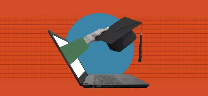 A hand out holding a graduation cap from a laptop screen to signify bachelor’s degree in computer science