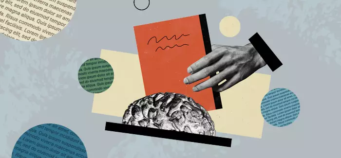 A hand holding a book next to a brain to represent 'does reading improve memory'