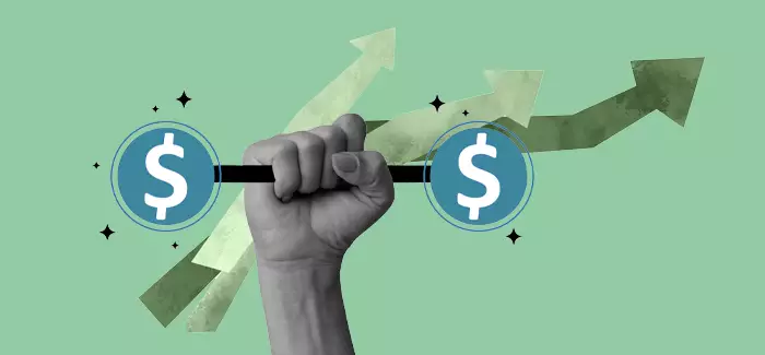 A hand holding up a weight made of money signs to signify how to improve your credit score