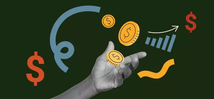 Hand tossing coins to signify finance skills