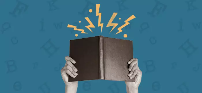 Hands holding up a book to signify fiction genres