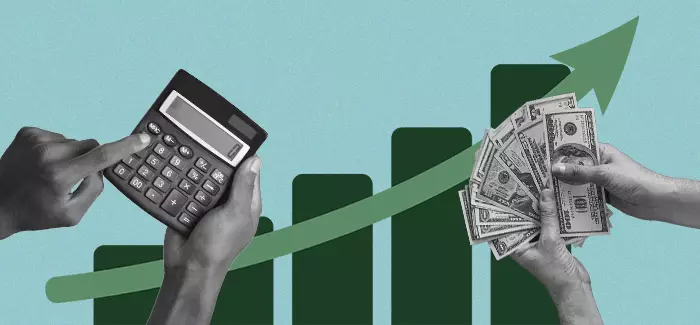 Hands using calculator and another holding money to represent how to calculate ROI