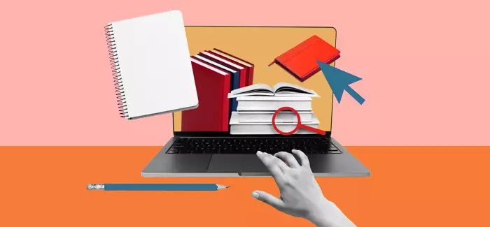 A hand reaching for a laptop computer with books and a pencil to signify why get an MBA online