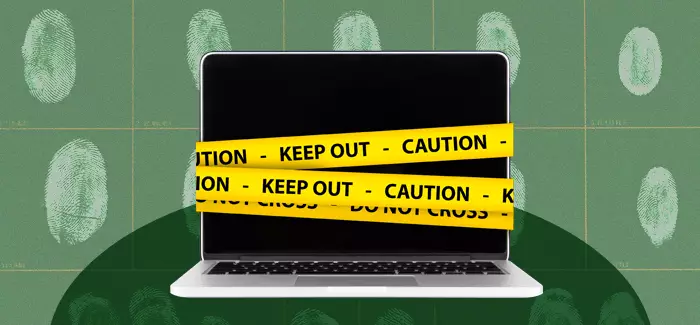 A laptop computer wrapped in yellow caution tape in front of a wall of fingerprints to signify digital forensics