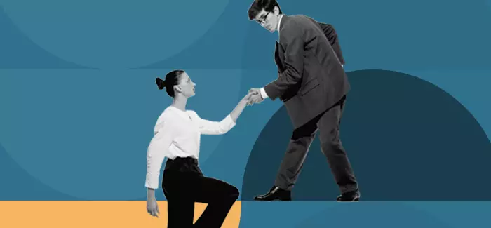 A make career coach helping a woman up a step