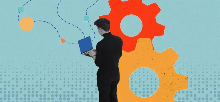 Man on laptop with gears to represent product manager interview questions