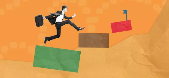 Man with briefcase running up steps to signify how to become a business manager