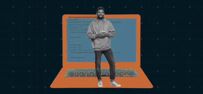 A male app developer standing in front of a large laptop to represent app developer skills