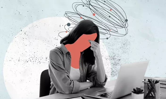 Illustrated graphic of mother struggling with burnout while working at desk.