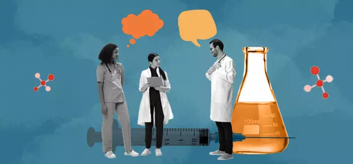 Two nurses talking to a doctor about the nursing model vs medical model of patient care