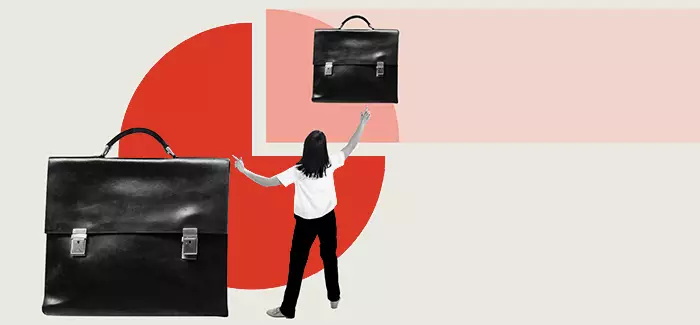 Person pointing to two suitcases to represent types of entrepreneurship