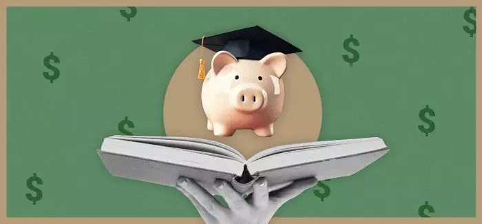 Piggy bank wearing graduation cap and floating above open book.