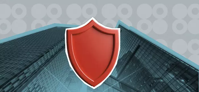 A red shield in front of a high rise to signify corporate security