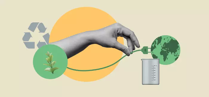 A hand plugging in an electrical plug into the world to represent an environmentalist and environmental scientist