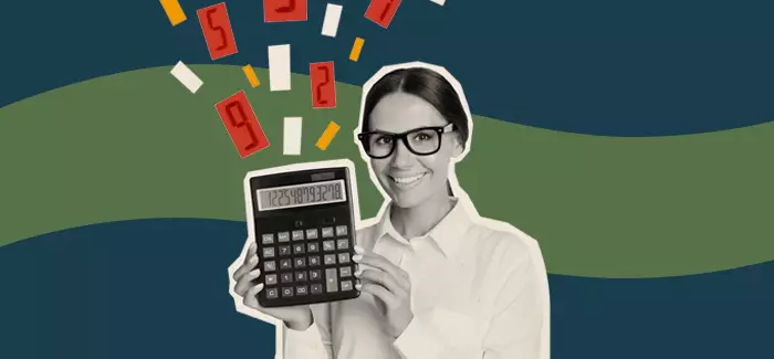 A woman holding a calculator explaining the difference between a bookkeeper vs accountant
