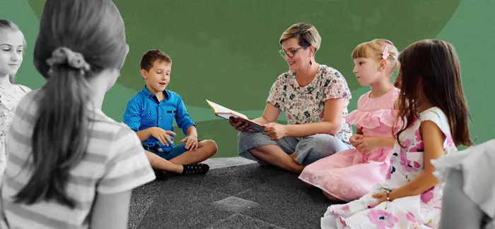 A teacher reading to children in a Montessori education setting