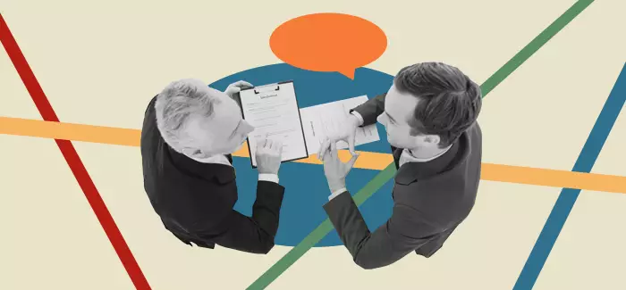 An entrepreneur who has learned what interview questions to ask start-up employees interviewing a job candidate