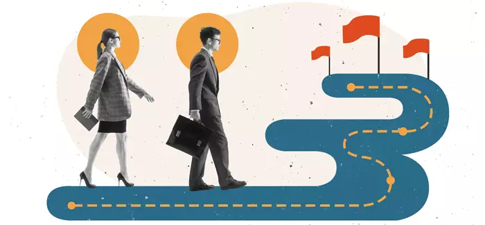 A professional man and woman walking toward a goal to signify applied dissertation
