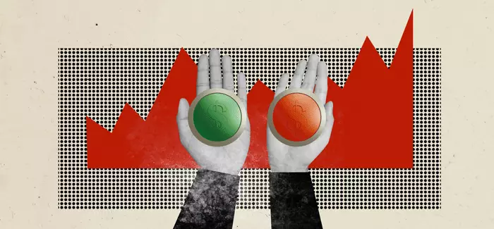 Two hands holding buttons to be pressed in front of a graph to symbolize a portfolio manager