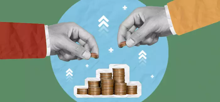 Two hands stacking coins to represent 'what is double accounting'.