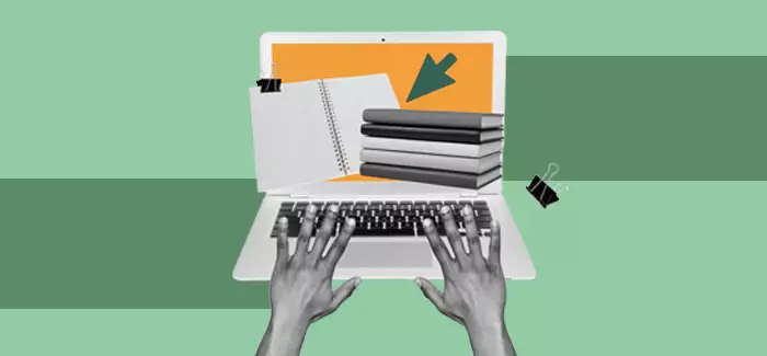 Hands typing on a laptop taking notes