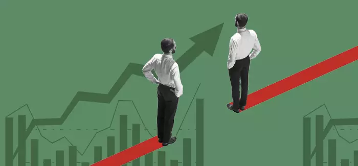 Two men standing on red stripes looking different directions on charts and graph, much like the information needed by a data analyst vs business analyst