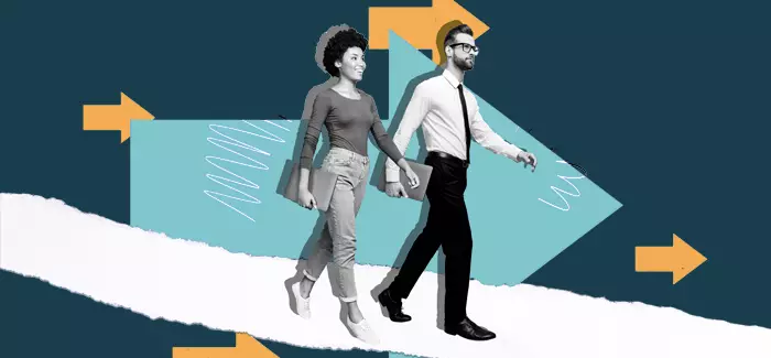 Two working professionals walking side by side to represent what is leadership in hr