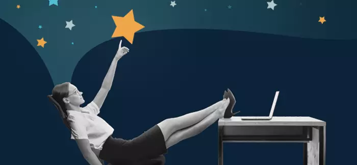 A professional woman leaning back in her pointing toward the stars to symbolize looking toward the future and whether or not you need to like your job