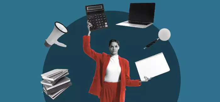 A femle project manager in a red suit surrounded by a laptop, notebook, books, calculator, megaphone and magnifying glass