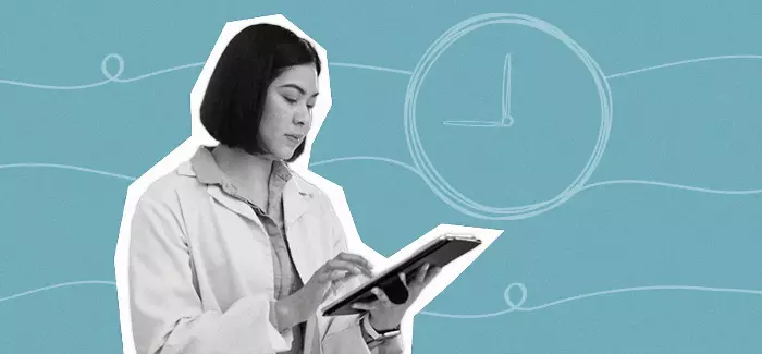 Healthcare management professional looking at an ipad