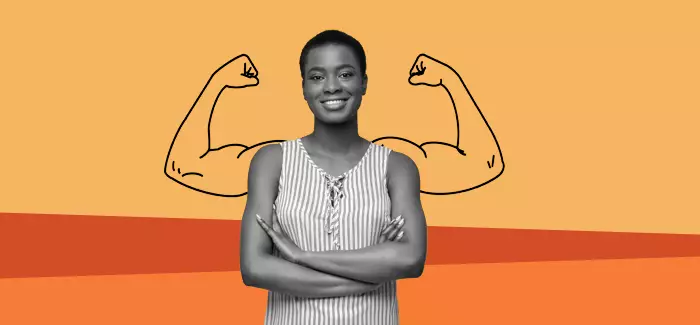 Confident woman with her arms crossed and flexed arms behind her signifying confidence-based assessments in employee training