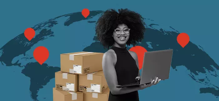 Woman holding a laptop in front of a map with locations marked where there might be jobs in supply chain management