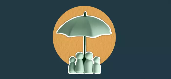 Clay statues under an umbrella to signify child protective services