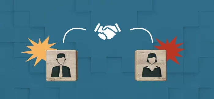 A male and female employee block shaking hands to signify employee relations manager