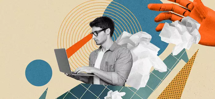 Man in glasses working on laptop wondering what the differences are between computer science vs. computer engineering